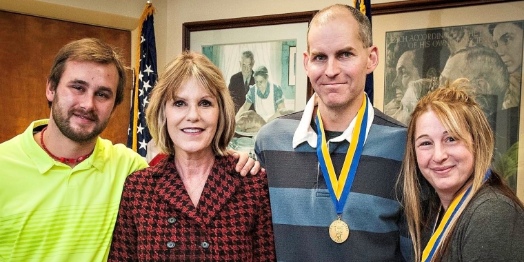 Senator Young honored Tom and Becky Simsick for their heroic rescue of Joshua Lightner. Left to right: Joshua Lightner, Senator Young, Tom Simsick & Becky Simsick.