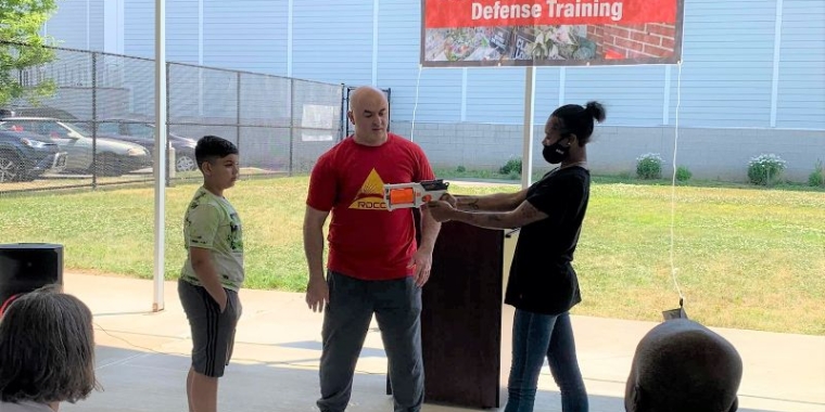 Some young volunteers from the audience agree to participate in an active shooter simulation as Michael Bottier, head instructor at Red Dawn Combat Club, teaches them how take down an armed assailant.