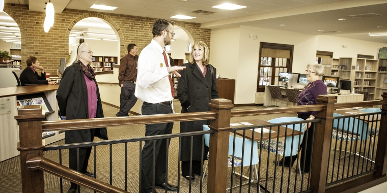 Senator Young talks with Library Director Frank Sykes in the library’s new addition