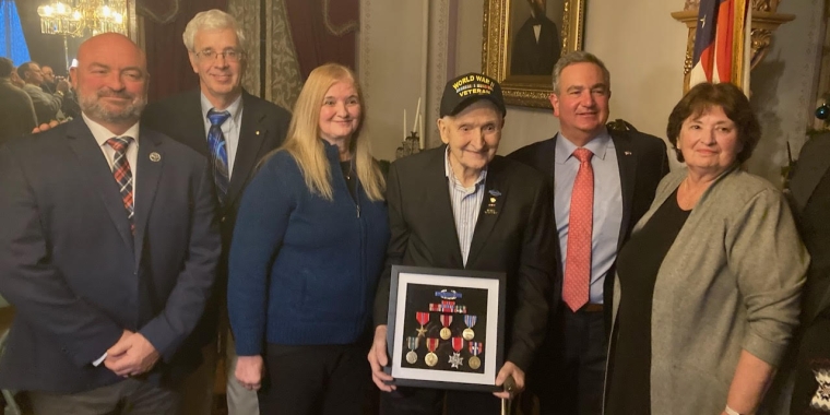 Shown from left-to-right: Chautauqua County Executive PJ Wendel, Assemblyman Andrew Goodell; Patricia Lindfors, daughter of PFC Tedesco; PFC Thomas Tedesco; Senator George Borrello; and Roseann Carlson, daughter of PFC Tedesco.