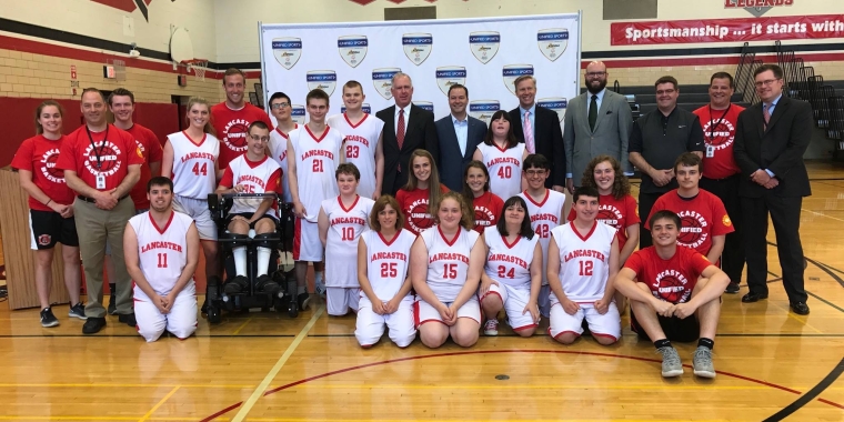 Lancaster High School students pose with elected officials and organizers before the Unified Sports games kicked off