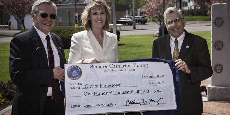Senator Catharine Young (center) presents a check for $100,000 to Veterans Memorial Park Commission Chairman Chuck Telford (left) and City of Jamestown Mayor Sam Teresi (right). The funding will help complete the renovations to Veterans Memorial Park.