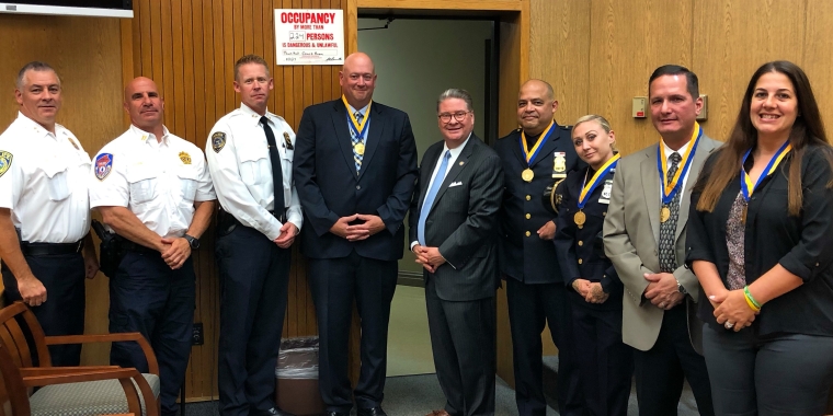 L to R: Chief Paul J. Oliva, Town of Mount Pleasant Police Department; Commissioner Thomas A. Gleason, Westchester County Police; Chief Erik Grutzner, Pleasantville Police Department; Detective Walter O’Keeffe; Senator Pete Harckham; Sergeant Juan Garcia; Officer Erin Holly; Detective Rob Barber; Detective Lauren Valentino