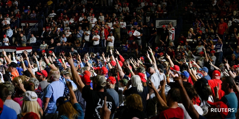 Trump Supporters salute the President on command during a rally in Youngstown, Ohio (Reuters)