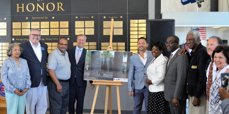 Pictured L-R: Madeline Scott, African-American Veterans Monument Committee; Terry McGuire, Board Chair, Buffalo & Erie County Naval & Military Park; Warren Galloway Chair, African-American Veterans Monument Committee; State Senator Chris Jacobs; Monument Designer Jonathan Casey; Assemblywoman Crystal Peoples-Stokes; Mayor Byron W. Brown; Ronal Bassham, African-American Veterans Monument Committee; Paul Marzello, Director, Buffalo & Erie County Naval & Military Park; Marina Woolcock, Board Member, Buffalo & Erie County Naval & Military Park.