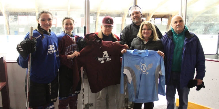 Assemblyman Gary Finch, Senator Pam Helming, and Auburn City Mayor Michael Quill meet with Auburn youth hockey players during a visit to the Casey Park Ice Rink in January.