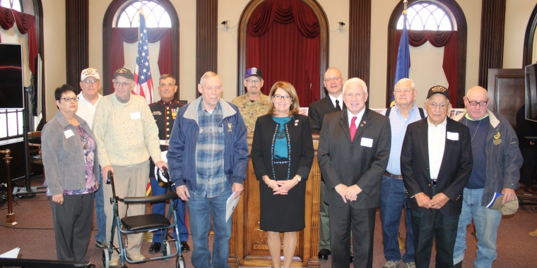 Senator Pam Helming stands with the veterans from Cayuga County and the Town of Lansing who were recognized for their nomination to the New York State Senate Veterans Hall of Fame during a ceremony at Memorial City Hall in Auburn.