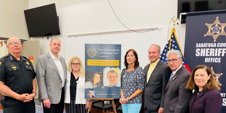 L-R: Saratoga County Sheriff Michael Zurlo, Brian and Debbie Rivers (parents of Deanna Rivers), Regina and Michael Stewart (parents of Christopher Stewart, Senator Jim Tedisco, and Saratoga County District Attorney Karen Heggen
