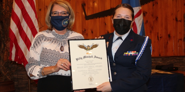 Senator Helming presents the prestigious General Billy Mitchell Award to Cadet Misty Hall on her promotion to Officer during the 2021 Canandaigua Civil Air Patrol annual banquet