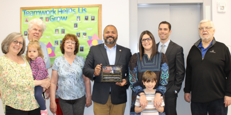 Senator Kevin Thomas presents the NYS Empire Award to Allison Ulin (third from left), Owner and Wantagh Director of Harmony Early Learning Center