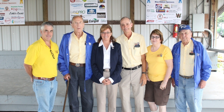 Senator Pam Helming stands with members of the Ontario County Board of Directors during the opening ceremonies of the 174th county fair in July.