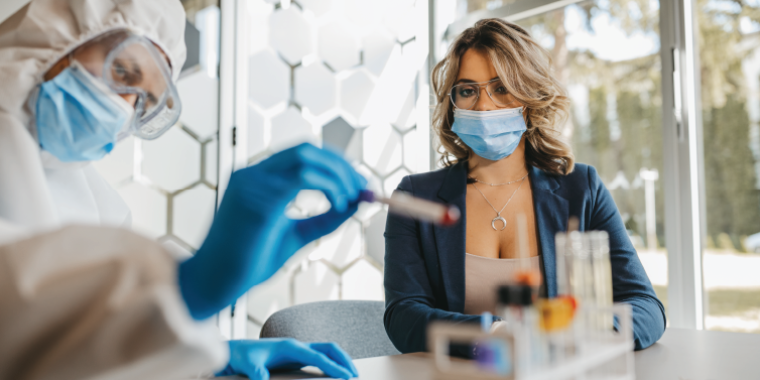 A woman waits for a COVID-19 swab test.