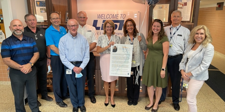 Senator Helming and members of the G.W. Lisk Leadership Team recognize VP of Human Resources Dina Stuck as the 2021 Woman of Distinction for the 54th Senate District
