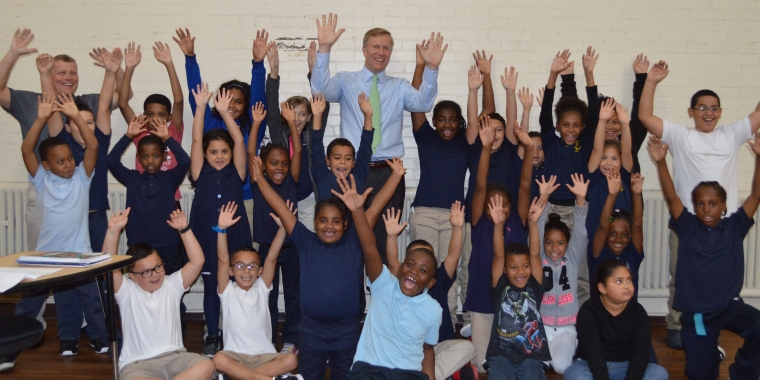 Senator Chris Jacobs and Northwest Buffalo Community Center Executive Director Larry Pernick celebrate with students over the announcement of the Senator's $50,000 in funding to support the renovation of the center's Educational Center.