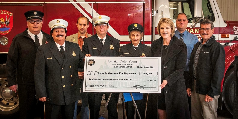 Shown from left to right are Persia Town Supervisor John Walgus, Gowanda Fire Chief Nick Crassi, Cattaraugus County Legislator Andy Burr, Assistant Fire Chief Mark Hebner, Fire Commissioner Carol Sheibley, Senator Cathy Young, Gowanda Mayor David Smith and Collins Town Supervisor Ken Martin.