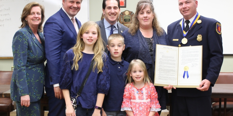 Sen. Kaminsky, Assemb. Griffin, and Mayor Corbett pose with Chief Ernest Bohringer and his family.