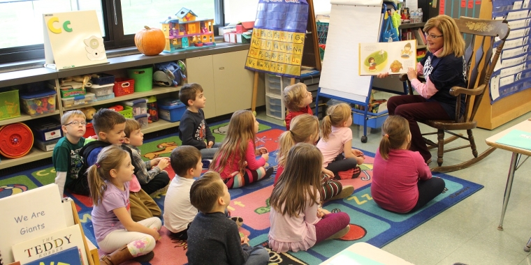Senator Pam Helming reads “Ordinary Mary’s Extraordinary Deeds” to Mrs. Stephanie Lando’s kindergarten class at Frank Knight Elementary School in Seneca Falls during a tour of the district on Monday, Nov. 27.