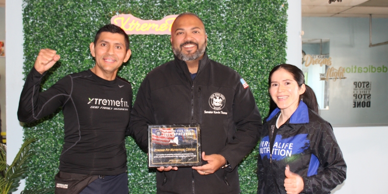NYS Senator Kevin Thomas (center) presents the Empire Award to Coach Mauri Campoverde and Lidia Cruz.