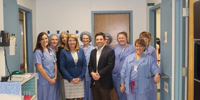 Senator Pam Helming stands with Dr. Dustin Riccio, President of the Eastern Region of Rochester Regional Health, and nurses from the surgical services team at Clifton Springs Hospital & Clinic during a tour of the premises.