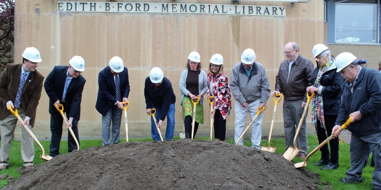 Senator Pam Helming, sixth from left, joins Edith B. Ford Memorial Library Director Shannon O’Connor, fifth from left; Library Board of Trustees President Sally Eller, second from right; project architects and engineers; and local officials for the groundbreaking of the addition of the library on Saturday, May 12.
