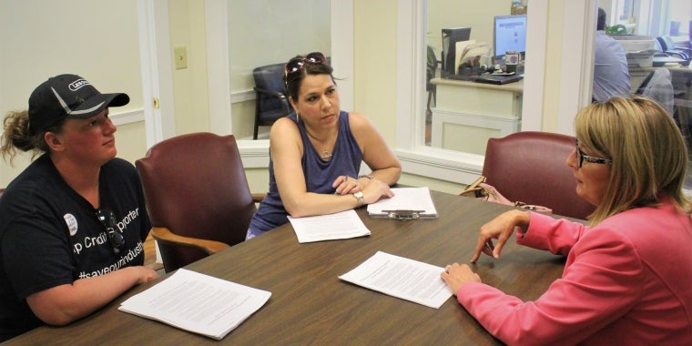 Aletea DeCuffa-Morales, left, of Joey’s Restaurant in Syracuse, and Kristen Flores-Fratto, of Gate House Cafe in Rochester, speak with Senator Pam Helming at her District Office in Geneva about their support for the current food service tip credit.