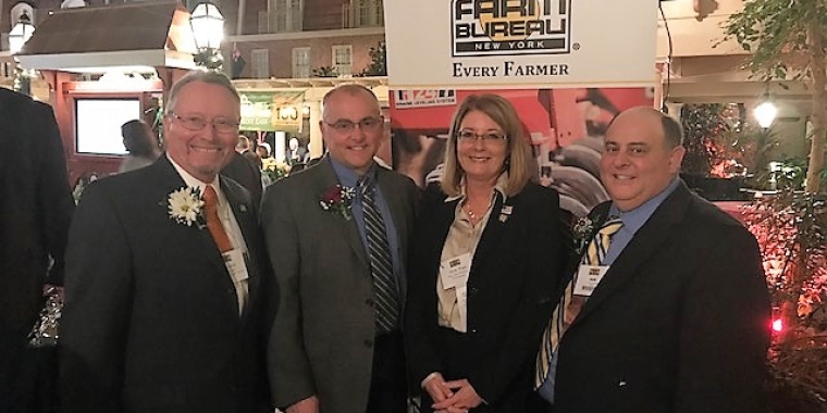 From left to right: New York State Department of Agriculture and Markets Commissioner Richard Ball, New York Farm Bureau President David Fisher, Senator Pam Helming, and NYFB District 3 Director John Sorbello.