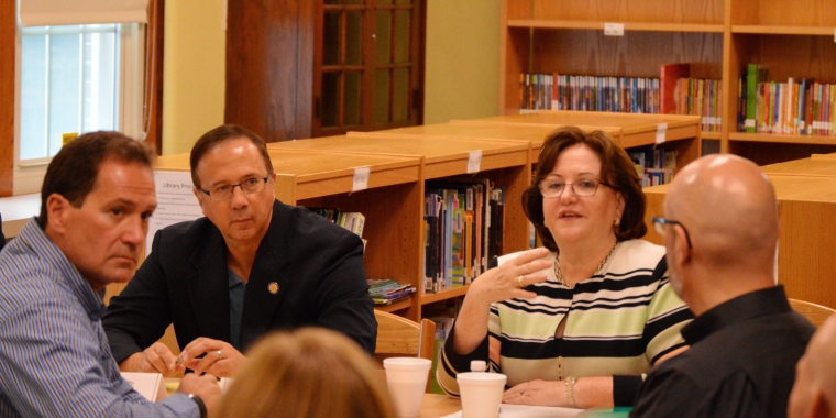 Senator Griffo sits alongside NYS Education Commissioner MaryEllen Elia during a visit to a Utica school