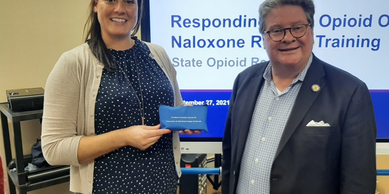 Mandee Nann of OASAS holding emergency naloxone kit and State Sen. Pete Harckham