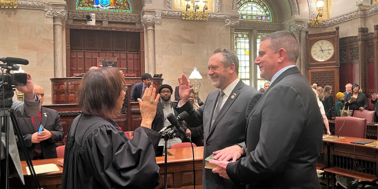Senator Peter Oberacker takes the oath of office on the floor of the New York State Senate at the Capitol in Albany. From left, Dean of the New York State Judicial Institute Honorable Kathie Davidson, Senator Peter Oberacker, Chief of Staff Ron Wheeler.