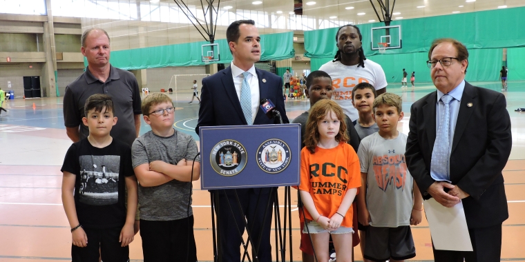 George Glover, Sen. Carlucci, and Assemblyman Abinanti with campers and camp staff