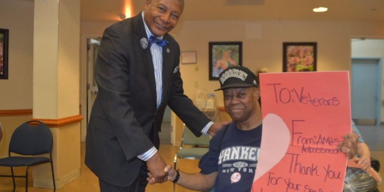 Senator Sanders presents a Valentine's Day card to Army veteran, Keith Scott.