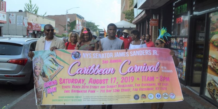 Senator Sanders led supporters in a mini-march to announce the upcoming Caribbean Carnival in the Rockaways.
