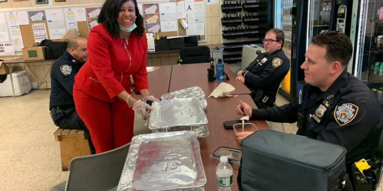 Team Sanders staffer Lisa George helps deliver meals to the 113th Precinct.
