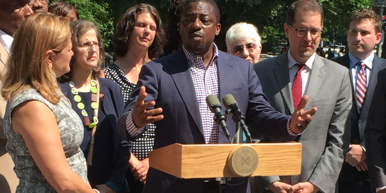 Standing with community leaders in August, calling for the removal of the statue.