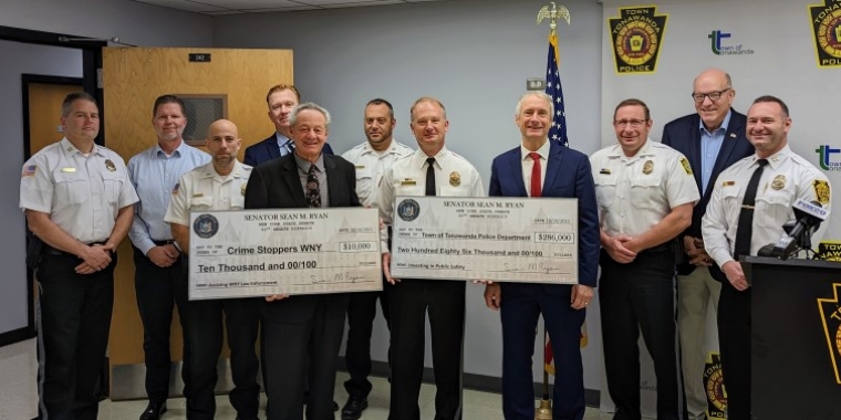 Senator Sean Ryan presents checks to Chief James P. Stauffiger and Paul Catalano of Crime Stoppers WNY, Oct. 20, 2022