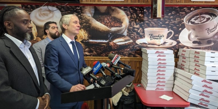 From left: Niagara Falls City Council Member Donta L. Myles, Assemblymember Jon Rivera, and Senator Sean Ryan address the media at Frankie's Donuts in Niagara Falls, Jan. 27, 2023