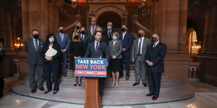 (At Podium: Senate Republican Leader Rob Ortt; Middle L-R: Senators Peter Oberacker, Sue Serino, Daphne Jordan, Jim Tedisco, Pam Helming, Mario Mattera; Back L-R: Senators Mike Martucci, Alexis Weik, Ed Rath, Dan Stec, Tom O'Mara, Anthony Palumbo, George Borrello)