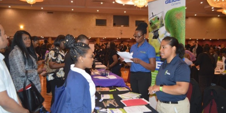 Hundreds of people packed the event and filled out applications seeking work.