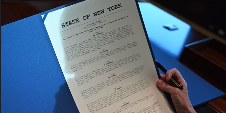 Gov. Hochul holding veterans legislation signed into law, including a bill introduced by Sen. Harckham