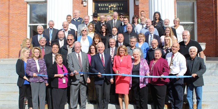 Senator Pam Helming prepares to cut the ribbon to officially open her Satellite Office in the Wayne County Court House in Lyons during a grand opening on Thursday, Oct. 26. Senator Helming was joined by Assemblyman Bob Oaks, Wayne County supervisors, and Wayne County officials.