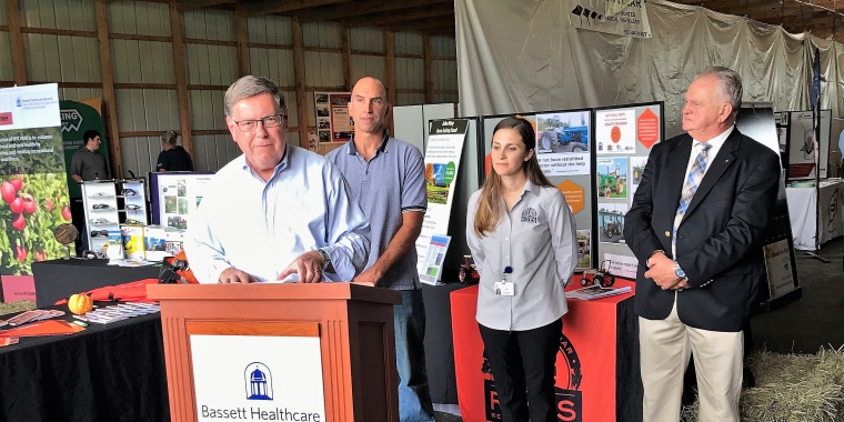 Senator James L. Seward announces a $250,000 state budget award for the continuation of the New York Rollover Protection System (ROPS) Rebate Program. From left, Senator Seward, Burlington Flats farmer Matthew Reinert, ROPS Hotline Coordinator Rebecca Russell, CNY Farm Progress Show President Dick Presky.