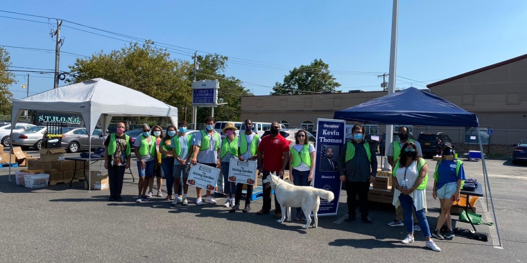 Senator Kevin Thomas and Island Harvest volunteers helped distribute food, PPE, and school supplies to over 450 families in Uniondale on Friday.