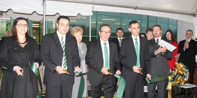 Members of the Karr family cut the ribbon this afternoon for Pride Pak’s new 68,000-square-foot vegetable processing and packaging plant in Medina. Steve Karr, fourth from left, is the company president and founder. He is pictured with his children, from left: Jennifer Pappas, quality director; Angelo Karr, vice president; Steve Karr’s wife Elsie (in back); Steve Karr; Greg Karr, vice president of procurement; and State Sen. Robert Ortt.