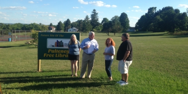 On a visit to the site of the future Pulteney Free Library last spring, Senator O'Mara meets with, from left to right: Library Director Barbara Radigan and Building Team members Carol McGill and Tom Smith.