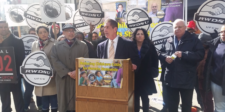 Photo: Senator Klein stands with Stuart Appelbaum (left), and Senator Savino (right).
