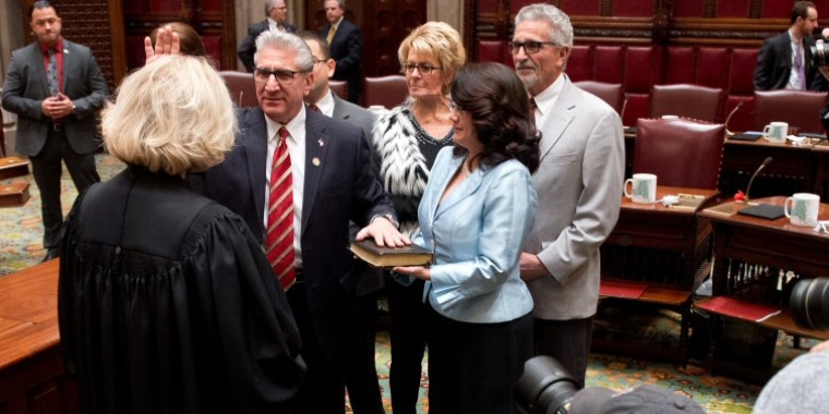 Senator Jim Tedisco being sworn into office in the NYS Senate Chamber. NYS Court of Appeals Chief Justice Janet DiFiore administered the oath of office. Also pictured holding the bible is Senator Tedisco's wife, Mary Song Tedisco and his brother Tom Tedisco and Sister-in-law Nancy Tedisco.