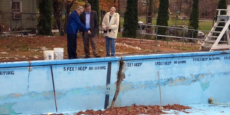 Senator Seward (center) surveys damage at the Village of Fleischmanns pool after announcing a $135,000 state grant to fund repairs. From left, Mayor Donald Kearney, Senator Seward, Deputy Mayor Harriet Grossman.
