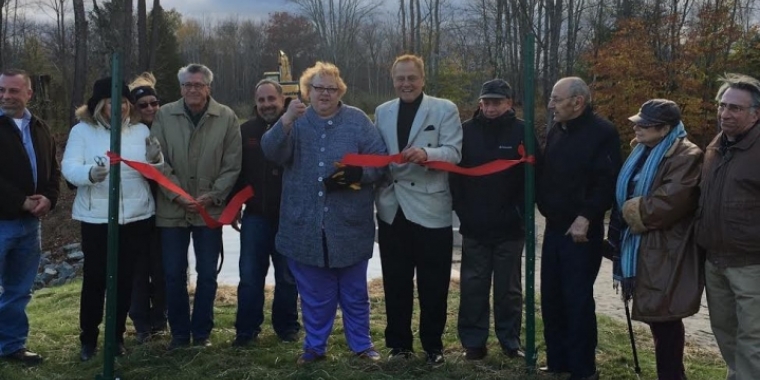 Senator Bonacic joins local officials to cut the ribbon on the newly rehabilitated Silver Lake Dam. To the left of Senator Bonacic is Village of Woodridge Mayor Joan Collins, and to her left is Town of Fallsburg Supervisor Steve Vegliante.