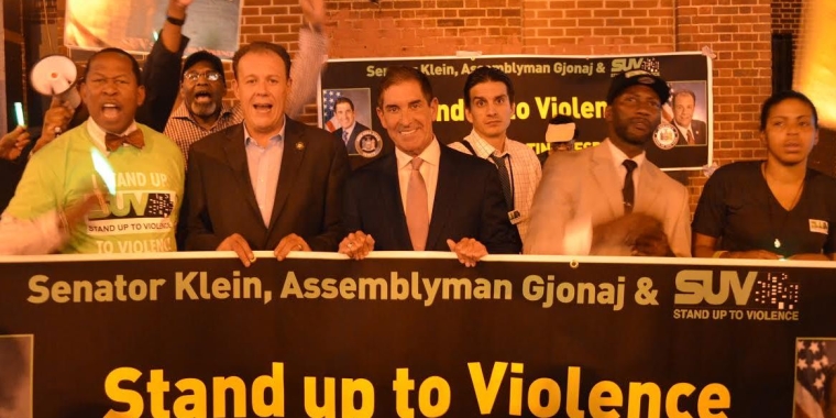 Photo caption (l-r): Councilman Andy King, Assemblyman Mark Gjonaj, Senator Jeff Klein, SUV Supervisor Kwame Thompson, and members of the community gather to celebrate the anniversary of SUV.