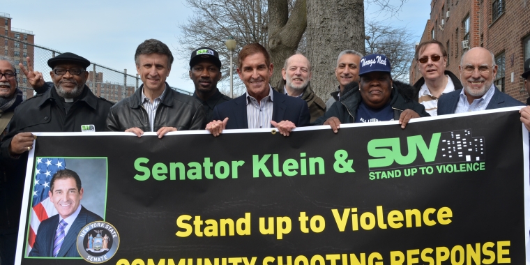 Photo Caption: SUV representatives, clergy members, and various community leaders join Senator Jeff Klein, Monique Johnson (Throggs Neck Houses), and Assemblyman Michael Benedetto as they kick off the rally.